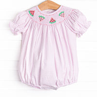 This bubble features a pink seersucker print, puff sleeves, and watermelon smockings.