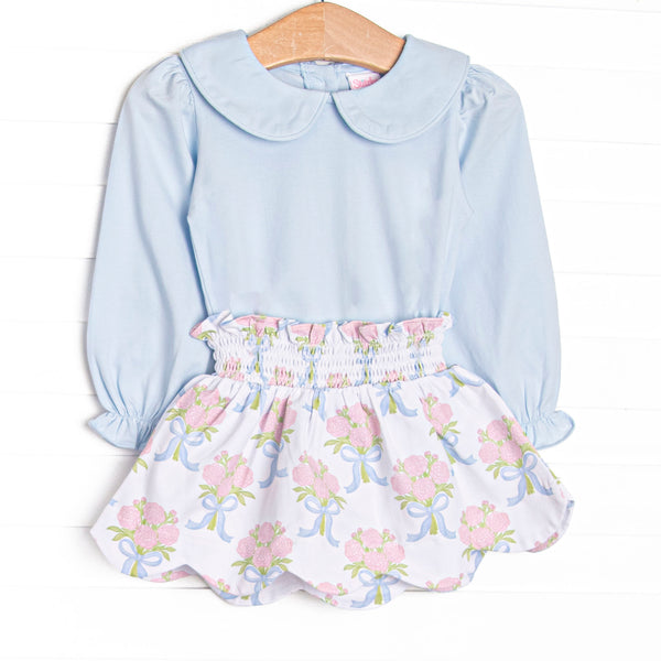This set features blue knit fabric, pink rose print, and a white Peter Pan collar. Coordinating skirt to match.