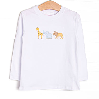 This top features white knit material, long sleeves, and an applique of giraffe, elephant, and lion.