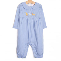 This romper features blue gingham print, peter pan collar, and an applique of giraffe, elephant, and lion.