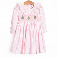 This dress features pink floral print, scalloped collar, and a trio of christmas tree smockings.