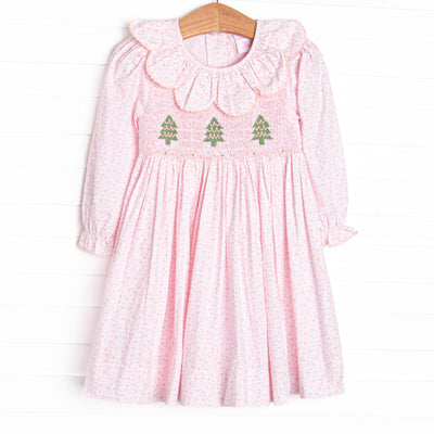 This dress features pink floral print, scalloped collar, and a trio of christmas tree smockings.