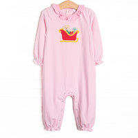 This romper features a pink striped print, snaps on the stride, and a puppy santa sleigh applique