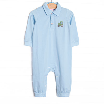  This romper features blue knit fabric, tractor embroidery, and a square collar. 