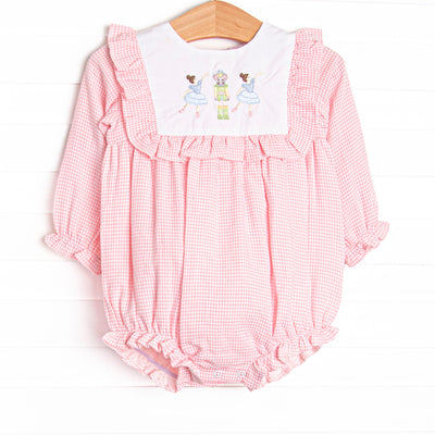  This bubble features a pink gingham print, ruffle trim, and a nutcracker embroidery. 
