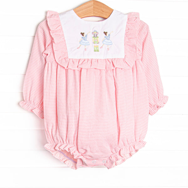  This bubble features a pink gingham print, ruffle trim, and a nutcracker embroidery. 