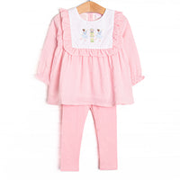 This set features a pink gingham print, ruffle trim, and a nutcracker embroidery. Coordinating pink leggings to match.