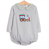 This bubble features sage striped knit material, a steam engine applique, and long sleeves