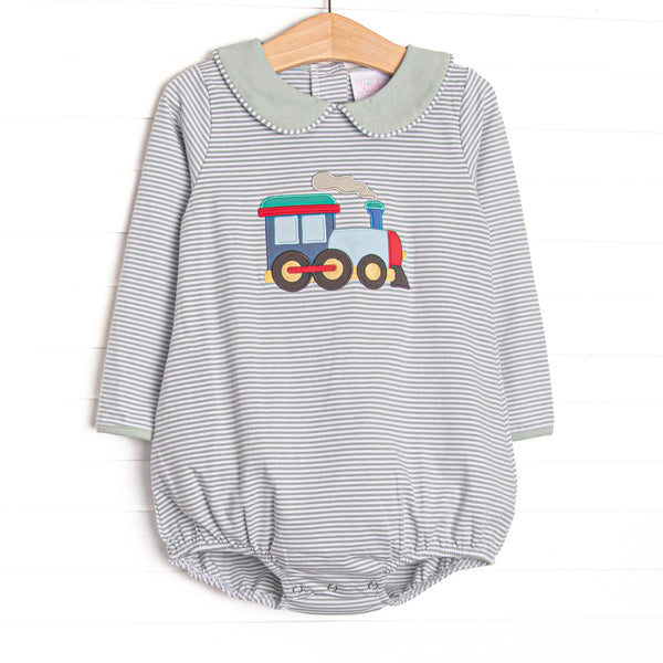 This bubble features sage striped knit material, a steam engine applique, and long sleeves