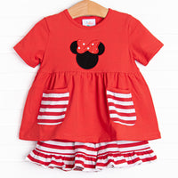  A bright pop of cheerful red, coupled with a red and white stripe ruffle shorts has us ready for a magical adventure. A mouse ears applique with a whimsical polka dot bow adorns the front of this set. 