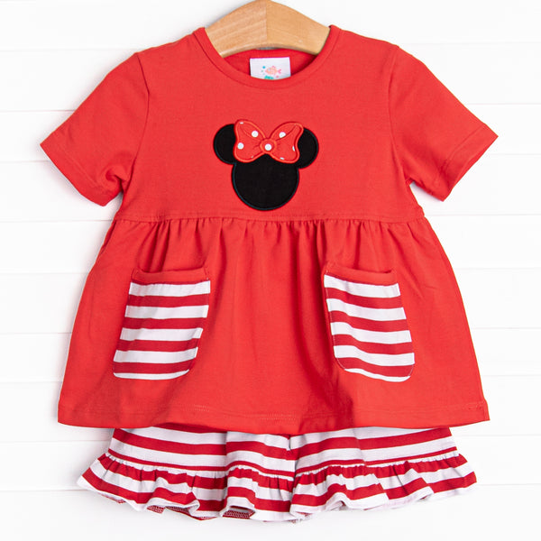  A bright pop of cheerful red, coupled with a red and white stripe ruffle shorts has us ready for a magical adventure. A mouse ears applique with a whimsical polka dot bow adorns the front of this set. 