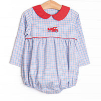 This bubble features blue and red plaid fabric, firetruck embroidery, and a red Peter Pan collar.