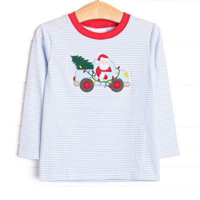  This top features a blue striped print, a red trim, and a santa truck applique. 