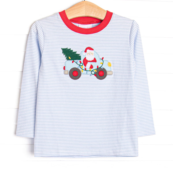  This top features a blue striped print, a red trim, and a santa truck applique. 