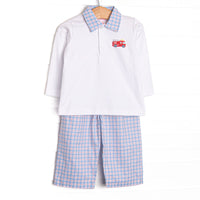 This set features a white top, firetruck embroidery, and a plaid polo collar. Coordinating blue and red plaid pants to match.