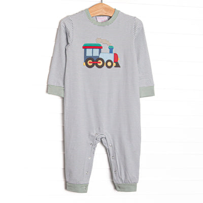 This romper features sage striped knit material, a steam engine applique, and snaps on the stride to make changing a breeze.