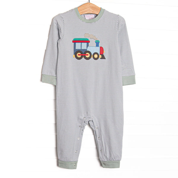This romper features sage striped knit material, a steam engine applique, and snaps on the stride to make changing a breeze.