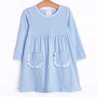 The dress features front ruffle pockets, light blue trim, medium blue&nbsp;stripes.