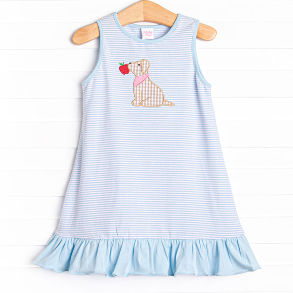  This dress features a blue striped print, blue ruffles, and a puppy applique. 