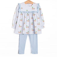 This set features a blue gingham duck print, ruffles around the chest, and long sleeves. Coordinating blue leggings to match.