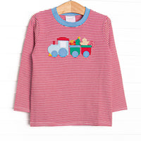This top features a red stripe print, blue trim, and a Christmas train applique.