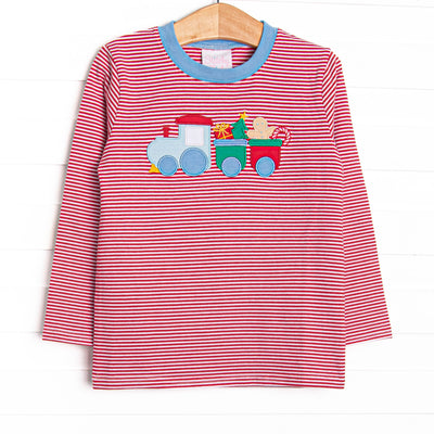 This top features a red stripe print, blue trim, and a Christmas train applique.