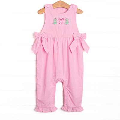 This romper features a pink gingham print, bows on the sides, and Christmas tree and bow embroidery.