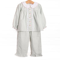This buset ble features a sage green gingham, peter pan collar, and santa embroidery.