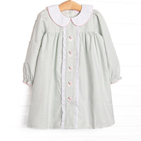 This dress features a sage green gingham, peter pan collar, and santa embroidery.