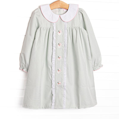 This dress features a sage green gingham, peter pan collar, and santa embroidery.