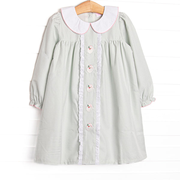 This dress features a sage green gingham, peter pan collar, and santa embroidery.