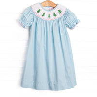 This dress features a aqua blue corduroy material, puff sleeves, and Christmas tree smockings