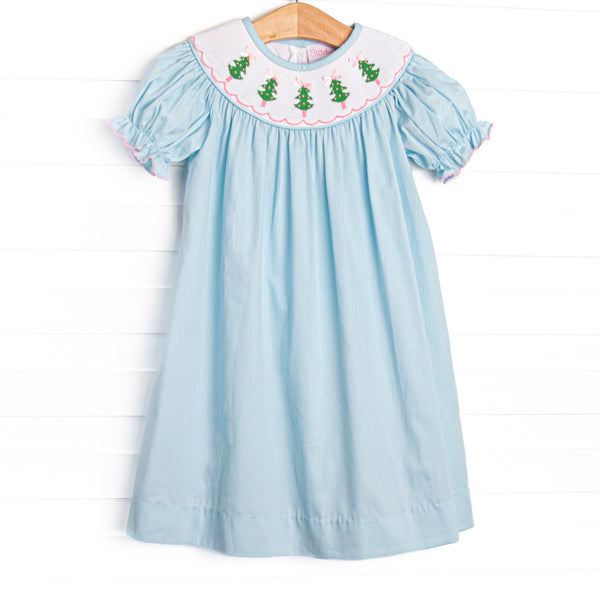 This dress features a aqua blue corduroy material, puff sleeves, and Christmas tree smockings