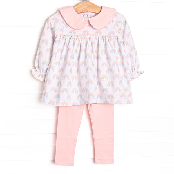 This set features rainbow patterned fabric, a pink Peter Pan collar, and long sleeves. Coordinating pink leggings to match.