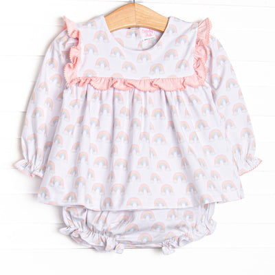 This set features rainbow patterned fabric, pink ruffle trim, and long sleeves. Coordinating diaper cover to match.