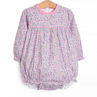  This bubble features purple floral fabric, pink piping and ruffle trim, and long sleeves. 