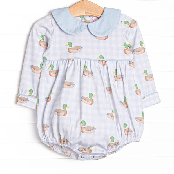 This bubble features a blue gingham duck print, a blue peter pan collar, and snaps on the stride.