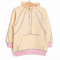  This pullover features yellow fleece fabric, floral trim, and a half zip. 