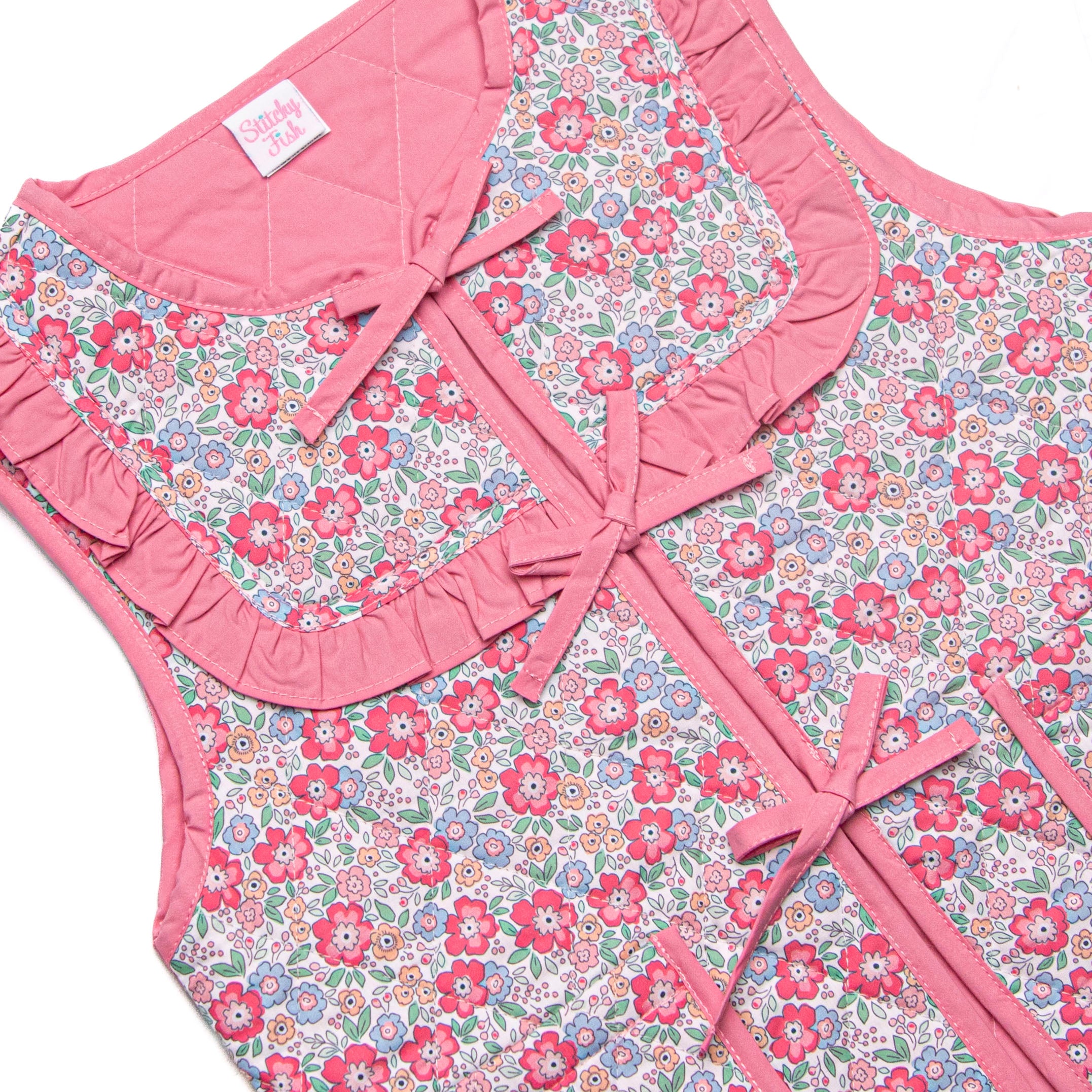 Frills and Florals Reversible Tie Front Ruffle Vest, Medium Pink