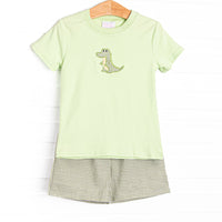  This set features a green top with a crocodile applique and coordinating green gingham shorts to match. 