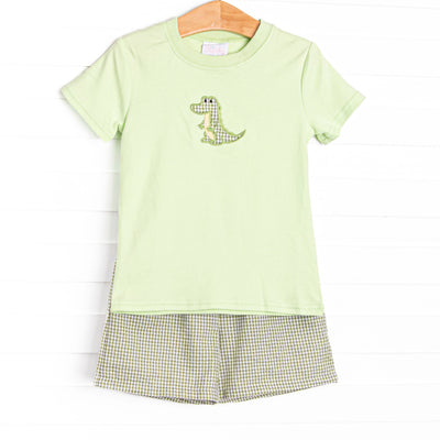  This set features a green top with a crocodile applique and coordinating green gingham shorts to match. 