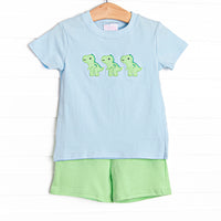  This set features a blue striped print, trio of dinosaur appliques, and green shorts to match. 