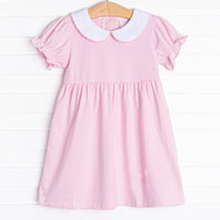  The Erin Dress is featured in pink and white striped print, short sleeves. and a white collar with a pink picot trim. 