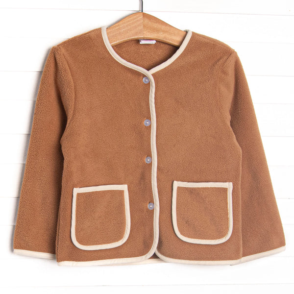 This coat features a brown fleece fabric, cream corduroy trim, and clear front buttons.