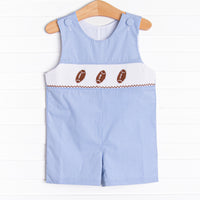 This&nbsp;Jon Jon&nbsp;features a blue mini gingham print, snaps on the stride, and a trio of football smocking.
