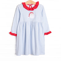 This dress features a blue striped print, red ruffle trim, and a Santa applique.