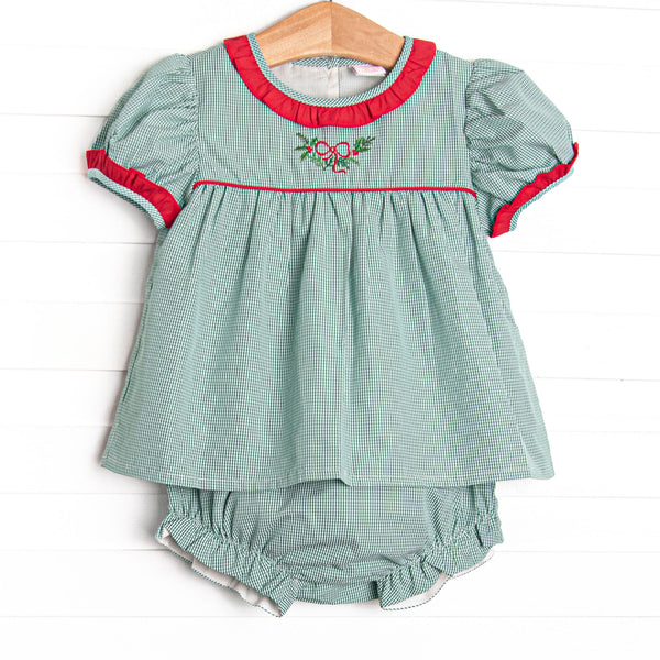  This set features a green gingham print, red ruffle trim, and a holly embroidery. 