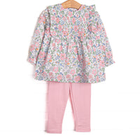 This set features a long sleeve top in a pink floral print with pink ruffles and long sleeves. Coordinating pink knit leggings to match.
