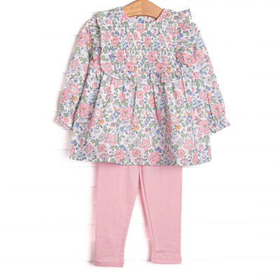This set features a long sleeve top in a pink floral print with pink ruffles and long sleeves. Coordinating pink knit leggings to match.