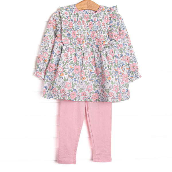 This set features a long sleeve top in a pink floral print with pink ruffles and long sleeves. Coordinating pink knit leggings to match.